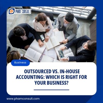 Outsourced accounting vs. in-house accounting: business professionals reviewing financial documents